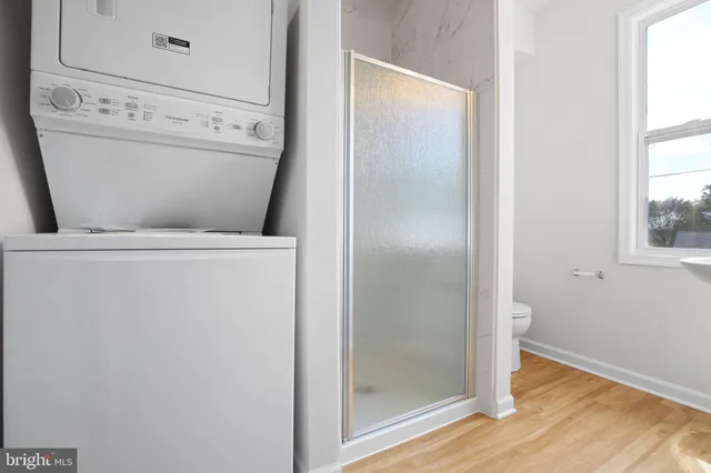 a close view of a utility room with washer and dryer
