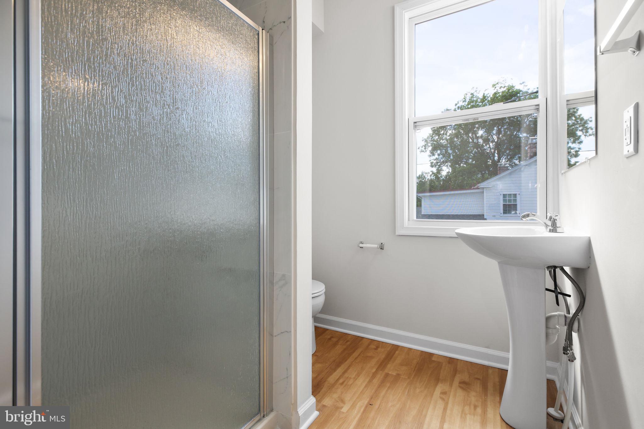 1424 William Street, Unit A Fredericksburg, VA 22401 - Photo 13 of 25 a bathroom with a bathtub