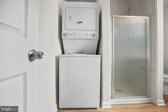 a close view of a utility room with dryer and washer