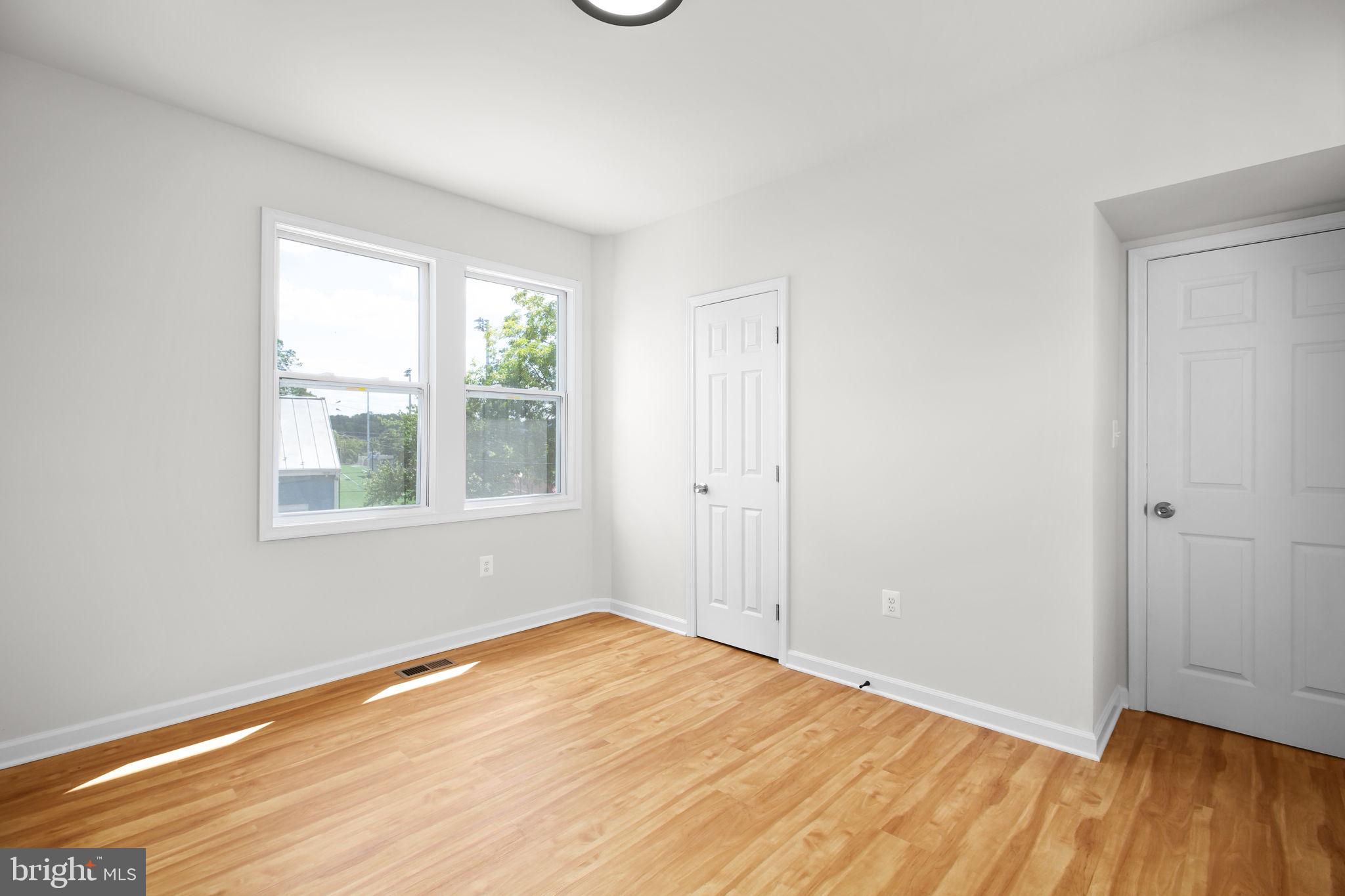 1424 William Street, Unit A Fredericksburg, VA 22401 - Photo 19 of 25 a view of empty room with wooden floor and fan
