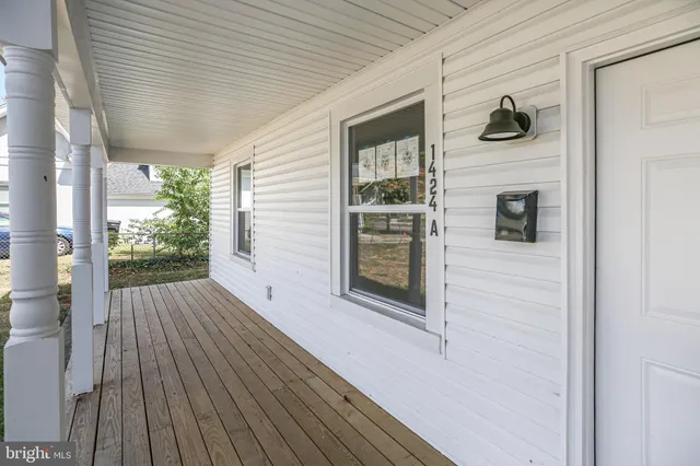 a porch with wooden floor and outdoor space