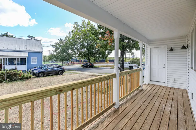 a view of a street with wooden floor