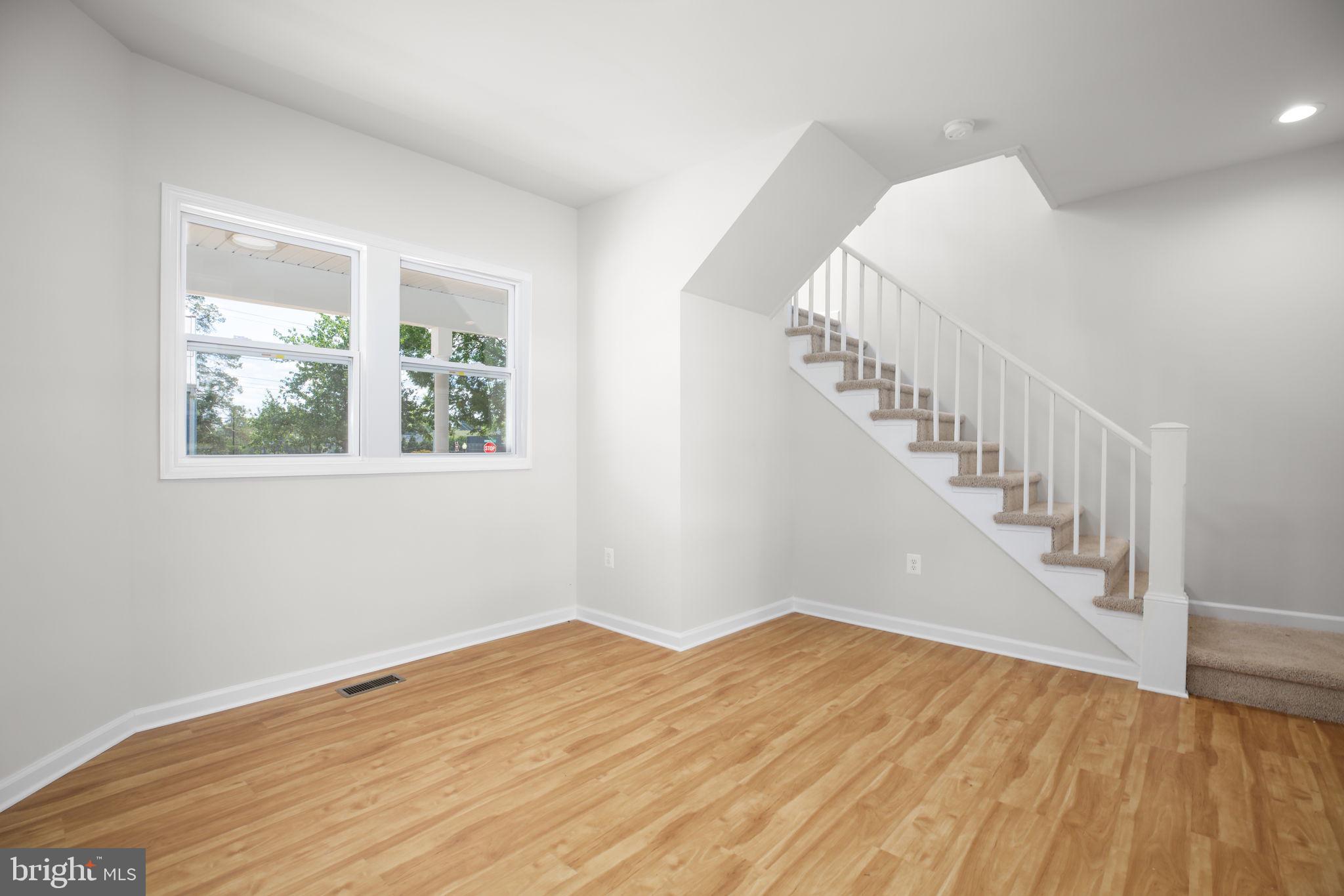 1424 William Street, Unit A Fredericksburg, VA 22401 - Photo 5 of 25 a view of a hallway with wooden floor and entryway