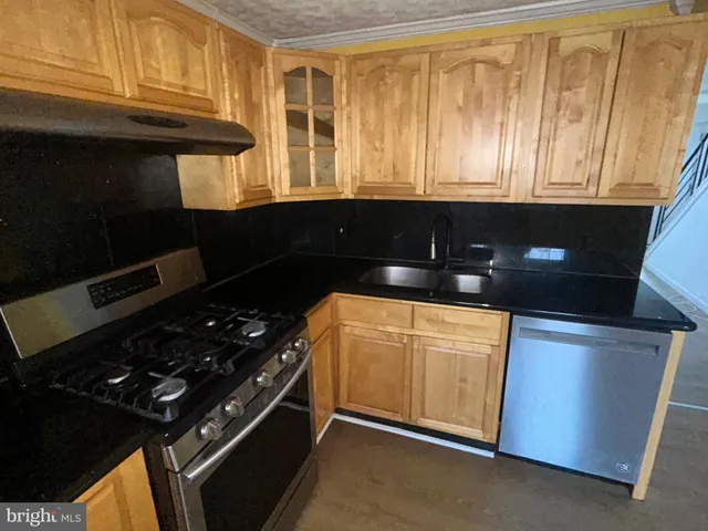 a kitchen with a stove and a microwave