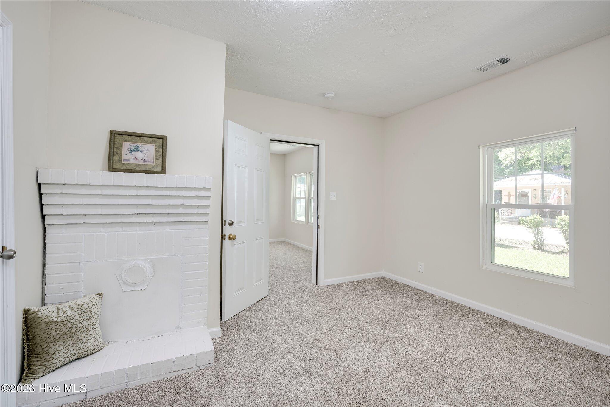 124 West Street Thomson, GA 30824 - Photo 16 of 28 Front Bedroom Fireplace