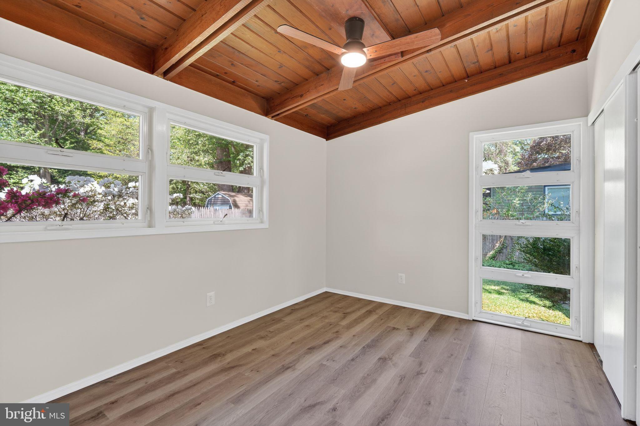 2931 Pine Spring Road Falls Church, VA 22042 - Photo 17 of 25 a view of an empty room with a window and wooden floor