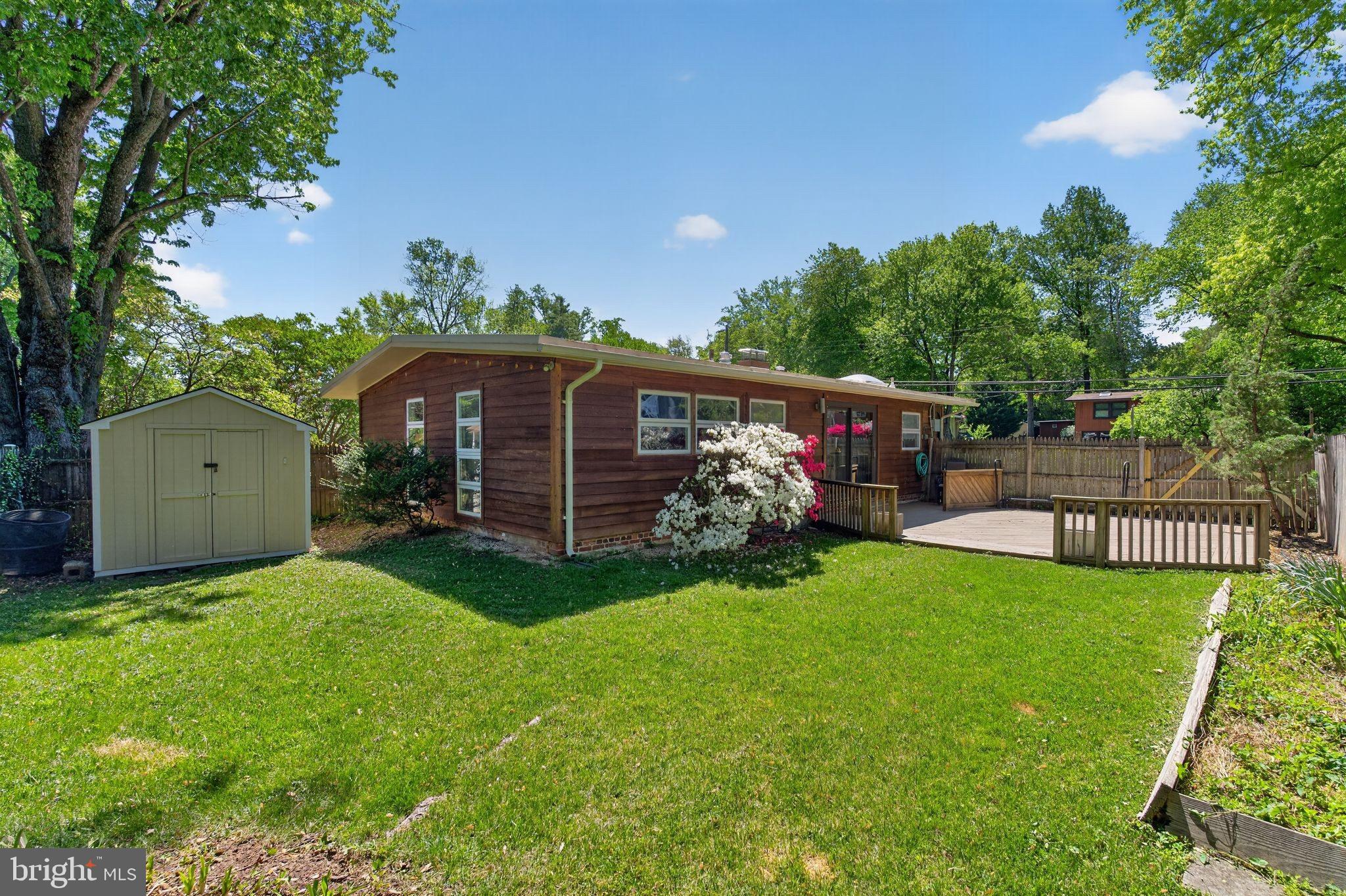 2931 Pine Spring Road Falls Church, VA 22042 - Photo 21 of 25 a view of a house with a yard and a garden