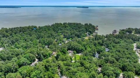 a view of a lake with a yard
