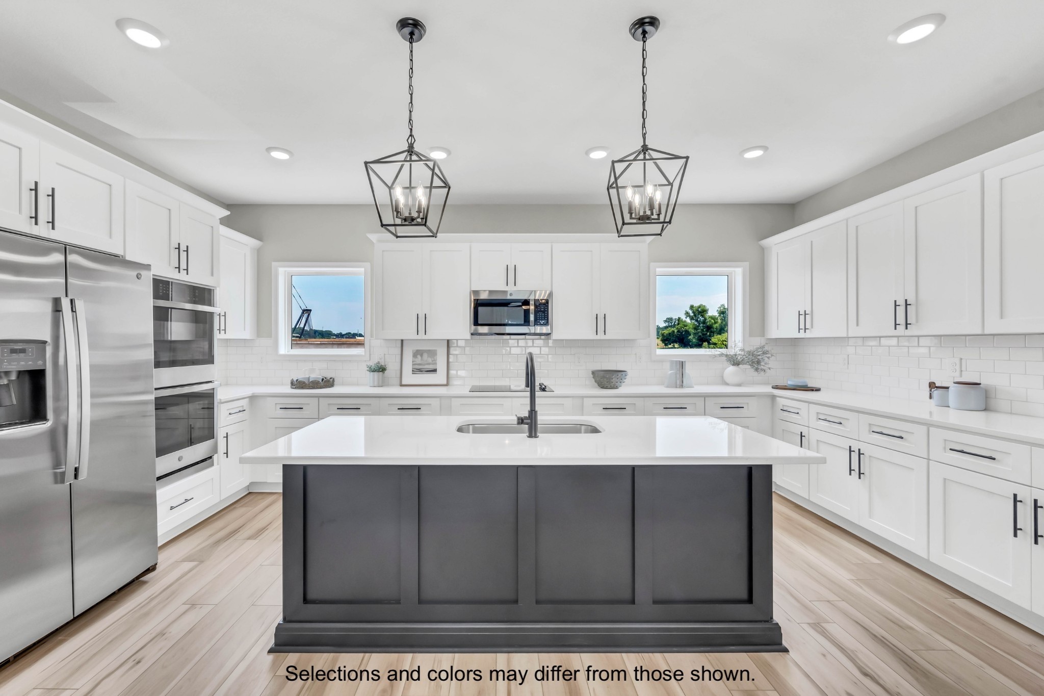 2375 Pea Ridge Road Clarksville, TN 37040 - Photo 10 of 18 a kitchen with stainless steel appliances granite countertop a sink a stove a refrigerator cabinets and chairs