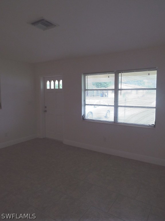 29 Andros Street Lehigh Acres, FL 33936 - Photo 3 of 16 an empty room with a window