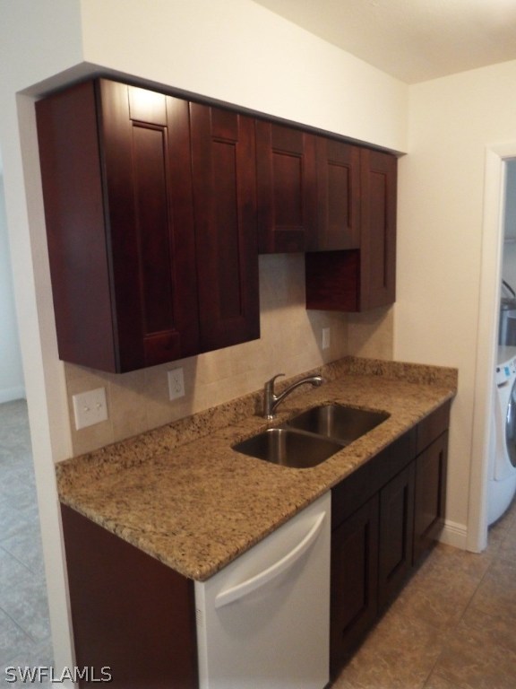29 Andros Street Lehigh Acres, FL 33936 - Photo 4 of 16 a kitchen with granite countertop a sink and a cabinets