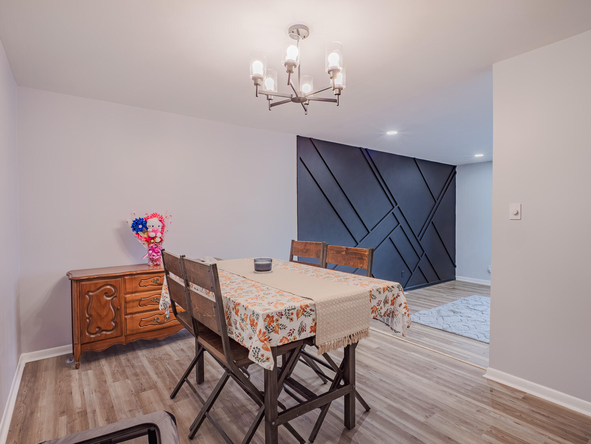 5301 Delaware Street Merrillville, IN 46410 - Photo 12 of 34 a view of a dining room with furniture and wooden floor