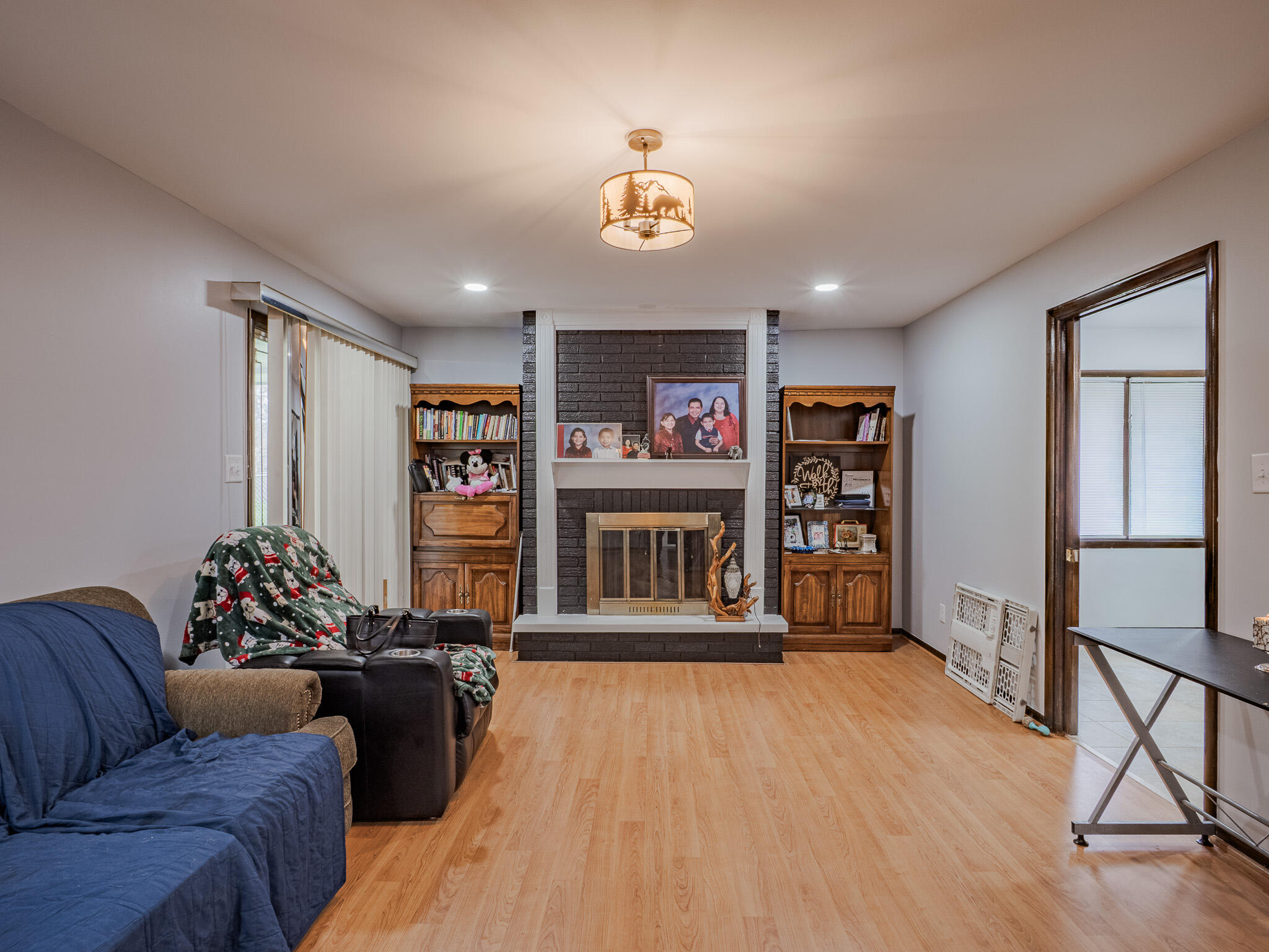 5301 Delaware Street Merrillville, IN 46410 - Photo 13 of 34 a living room with furniture a couch and a bookshelf