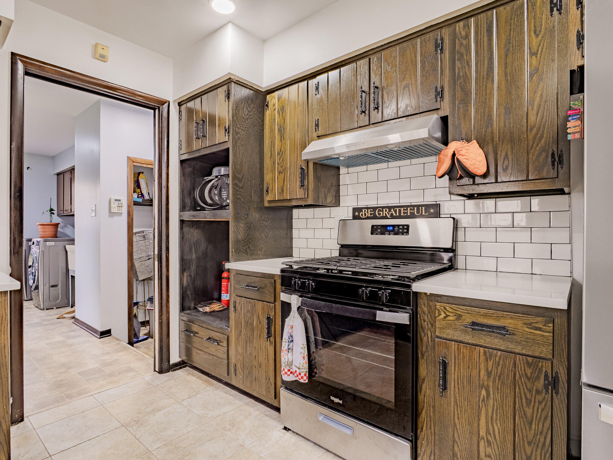 5301 Delaware Street Merrillville, IN 46410 - Photo 17 of 34 a stove top oven sitting inside of a kitchen