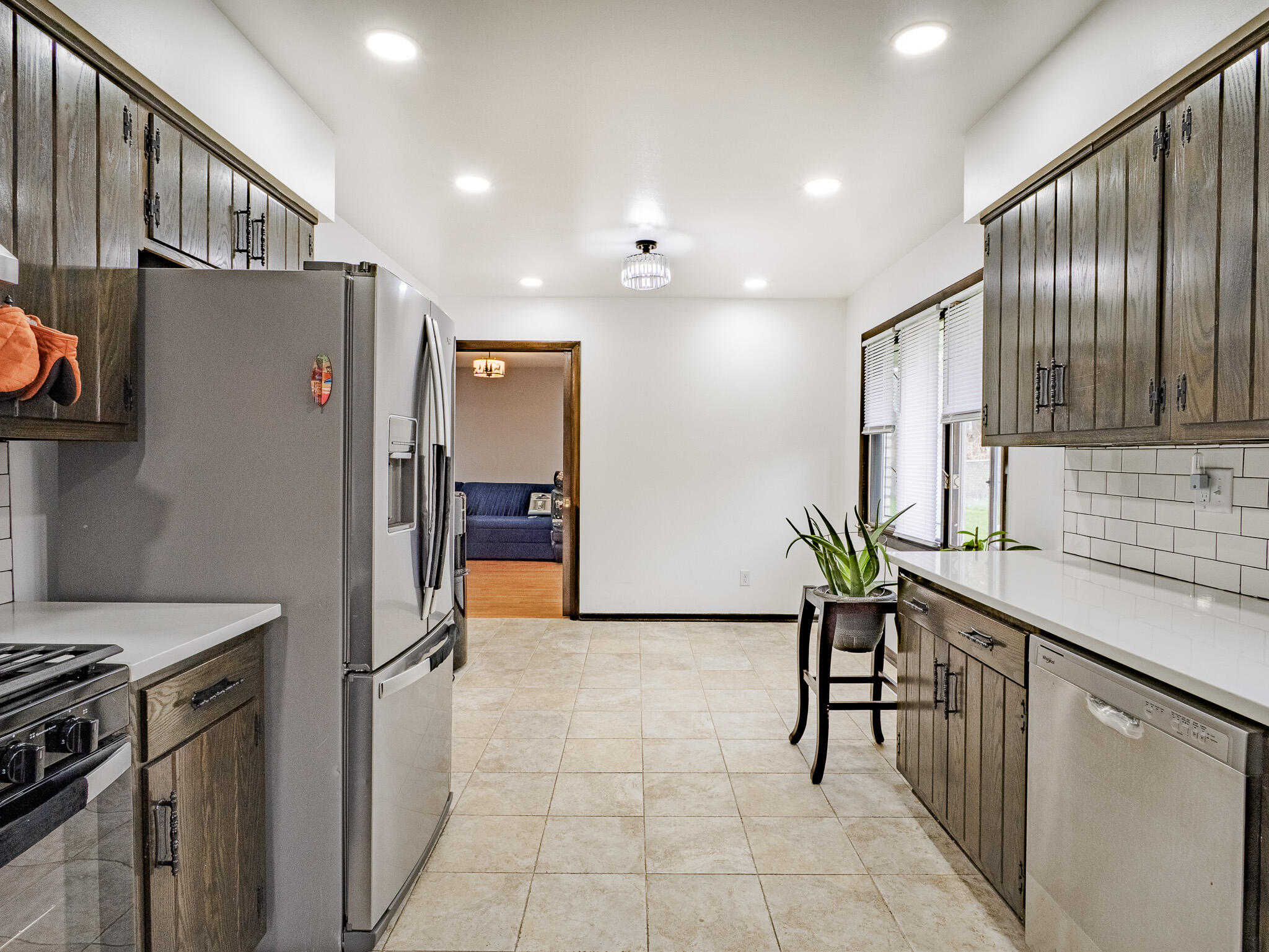 5301 Delaware Street Merrillville, IN 46410 - Photo 18 of 34 a kitchen with stainless steel appliances granite countertop a refrigerator and a sink