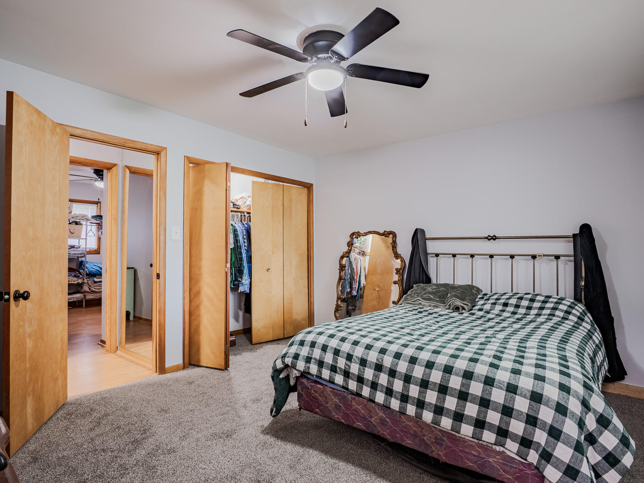 5301 Delaware Street Merrillville, IN 46410 - Photo 22 of 34 a bedroom with a large bed and a chandelier