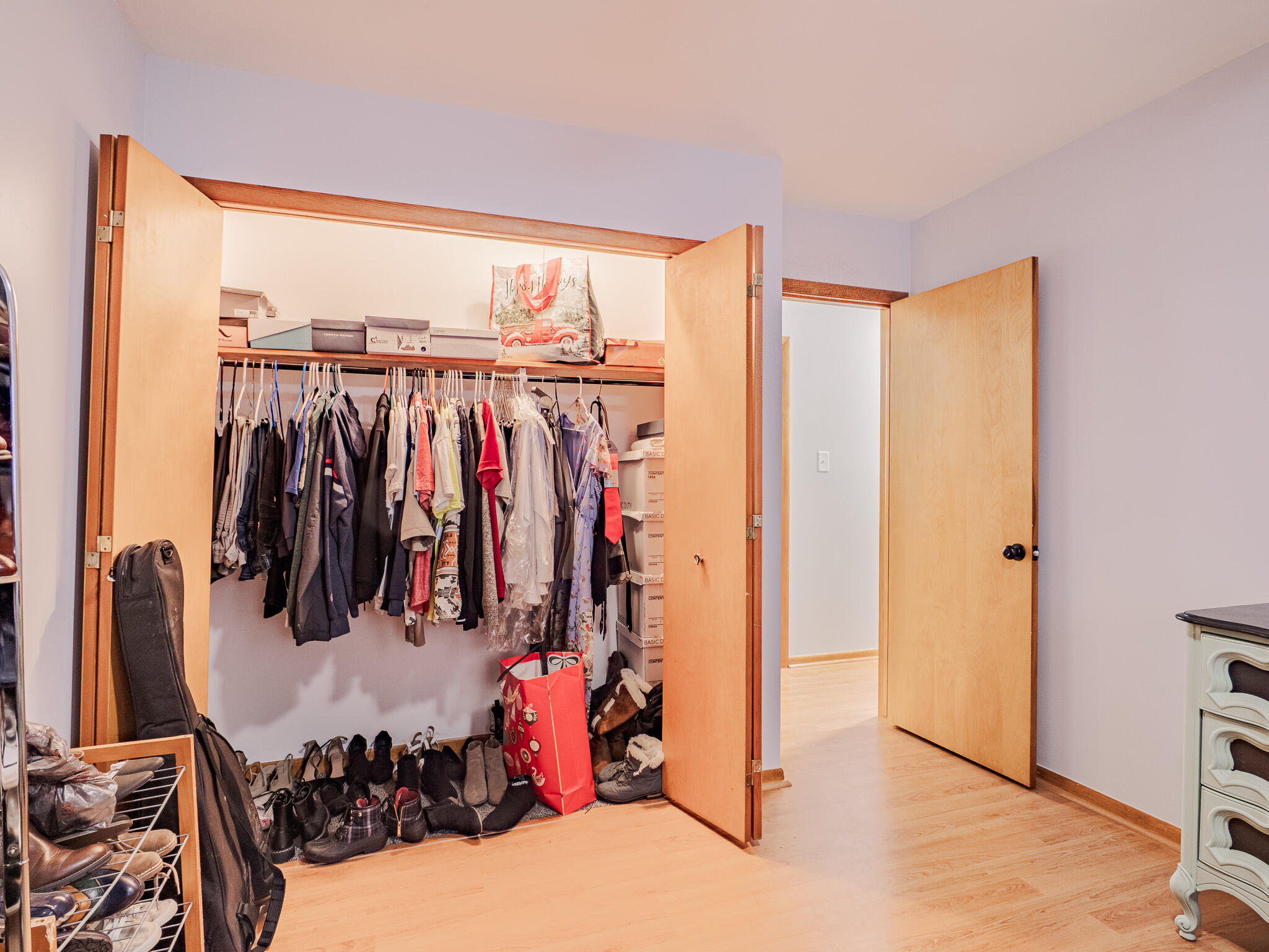 5301 Delaware Street Merrillville, IN 46410 - Photo 26 of 34 a view of walk in closet with clothes and shoes