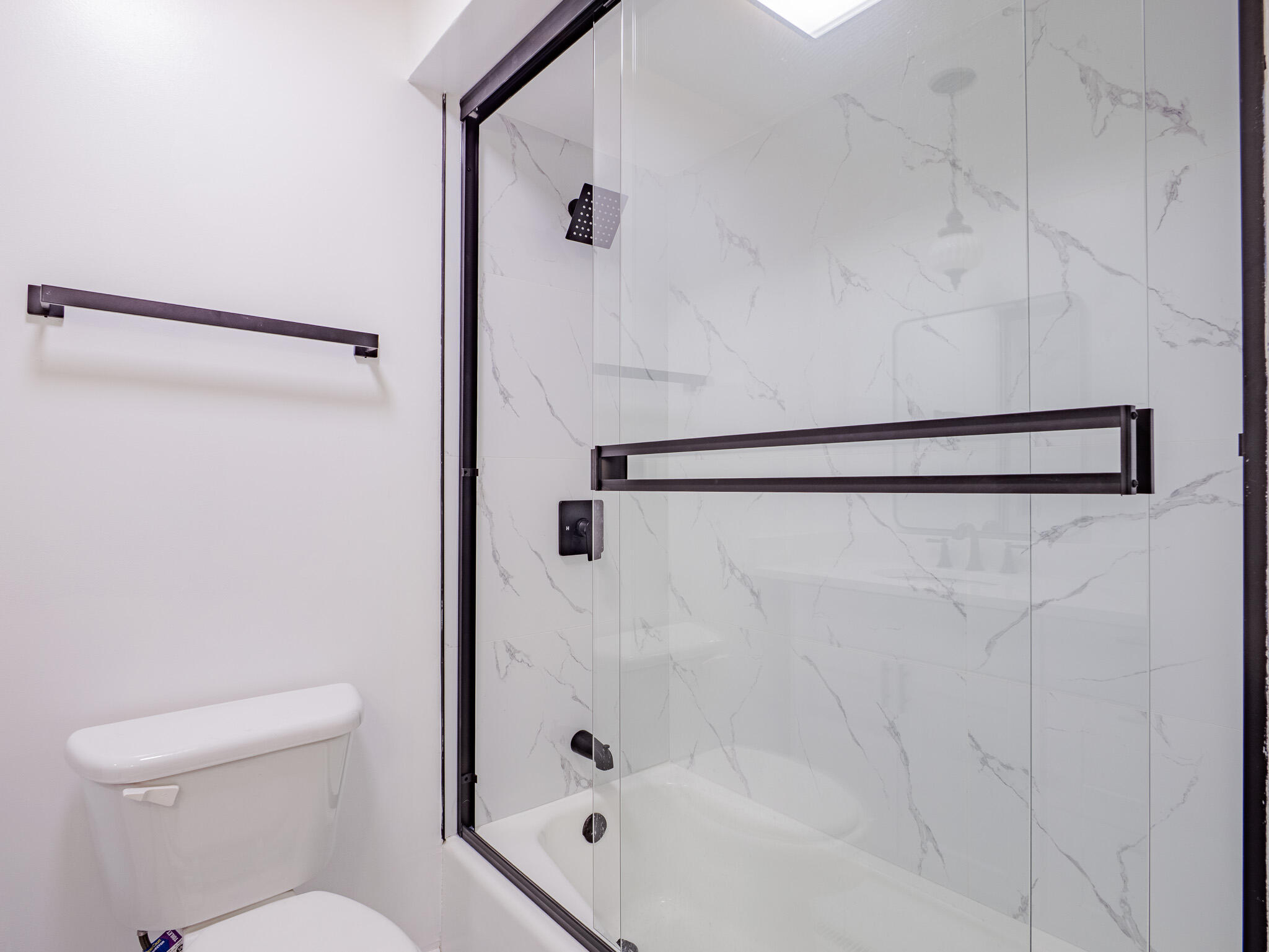 5301 Delaware Street Merrillville, IN 46410 - Photo 28 of 34 a bathroom with a shower and a toilet