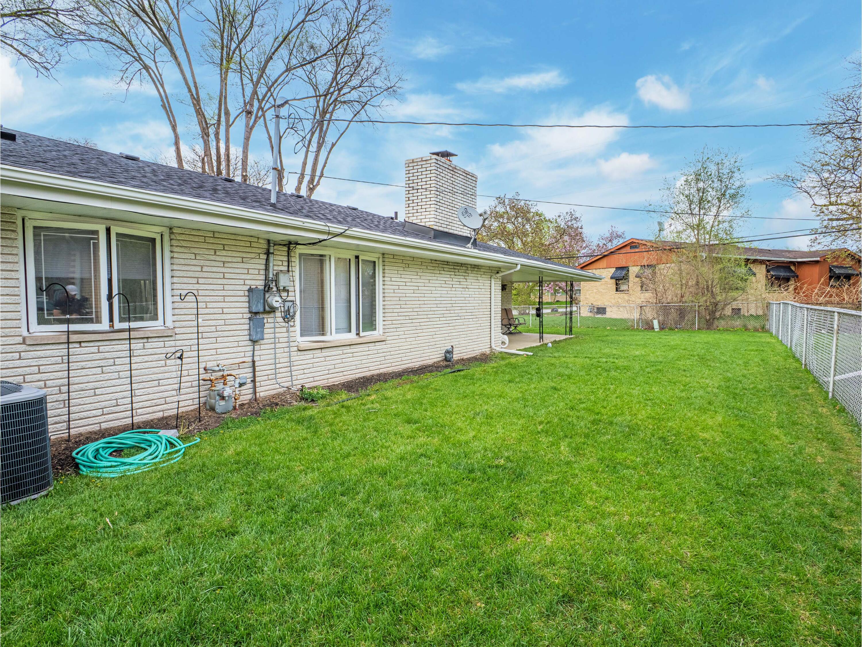 5301 Delaware Street Merrillville, IN 46410 - Photo 5 of 34 a front view of a house with a garden