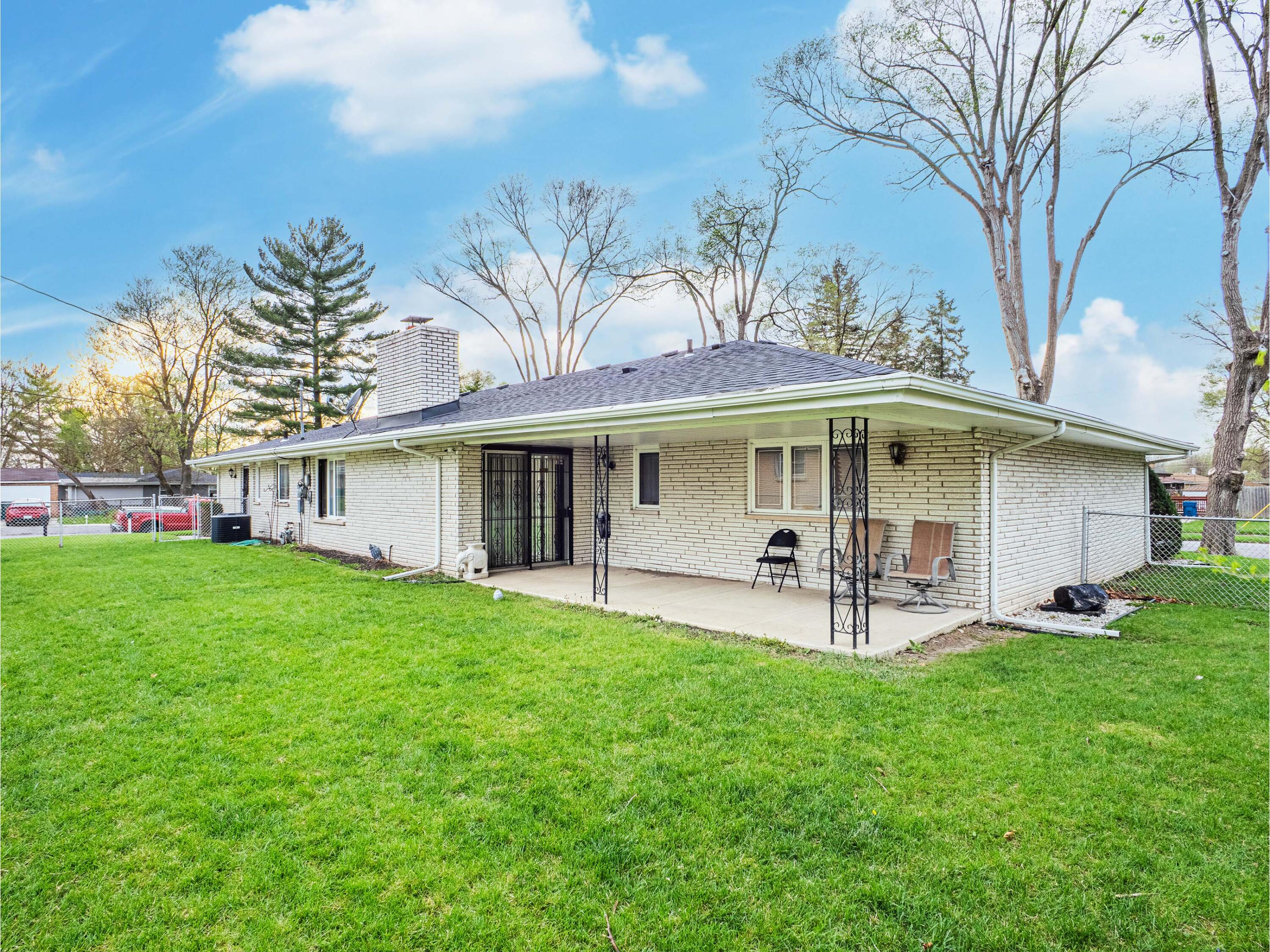 5301 Delaware Street Merrillville, IN 46410 - Photo 6 of 34 a front view of a house with garden and porch