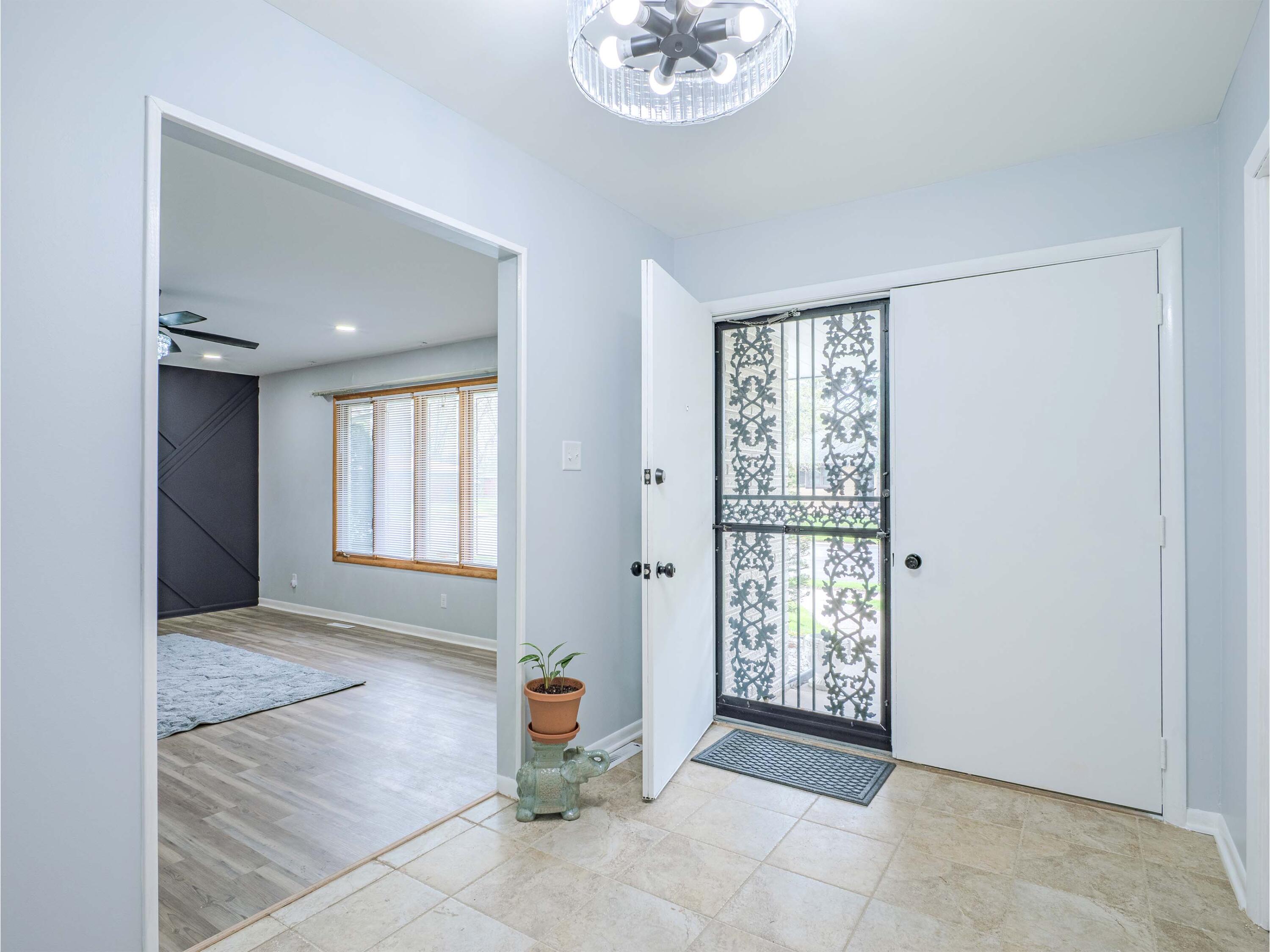 5301 Delaware Street Merrillville, IN 46410 - Photo 8 of 34 a view of an empty room with a window
