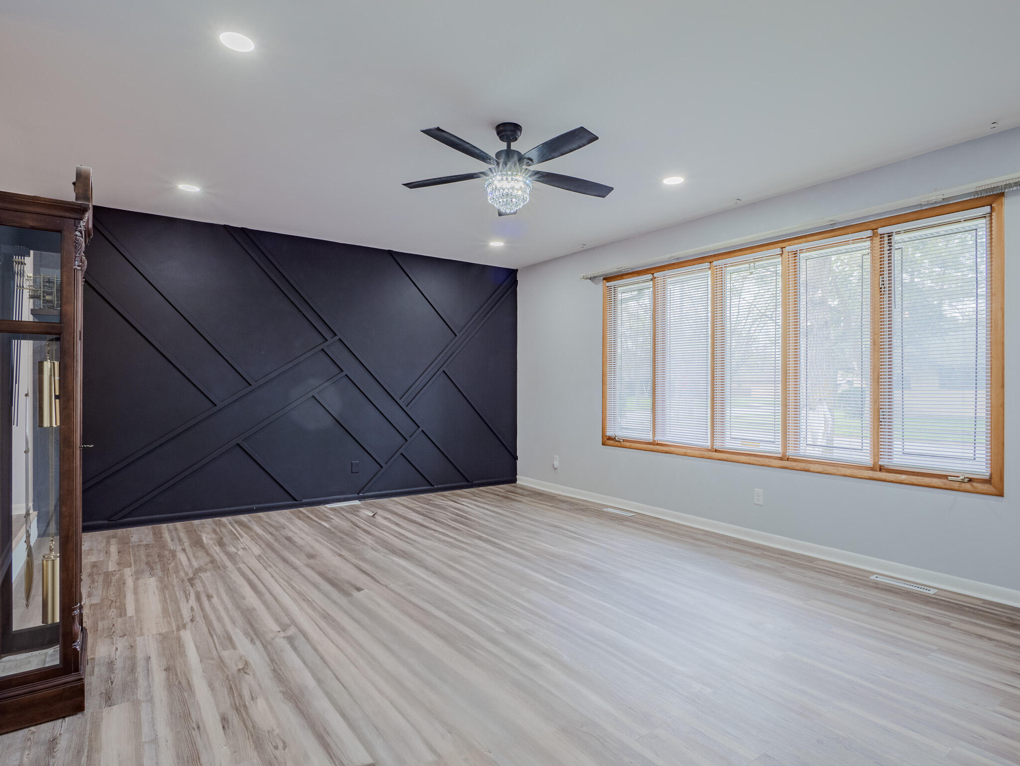 5301 Delaware Street Merrillville, IN 46410 - Photo 10 of 34 a view of an empty room with a window and wooden floor