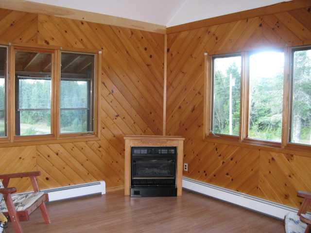 1583 County Road Greenbush, ME 04418 - Photo 18 of 35 Living Room. The living room has...