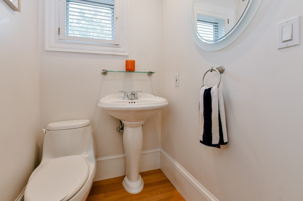 90 Constitution Road, Unit 90 Boston, MA 02129 - Photo 13 of 29 a bathroom with a toilet sink and mirror