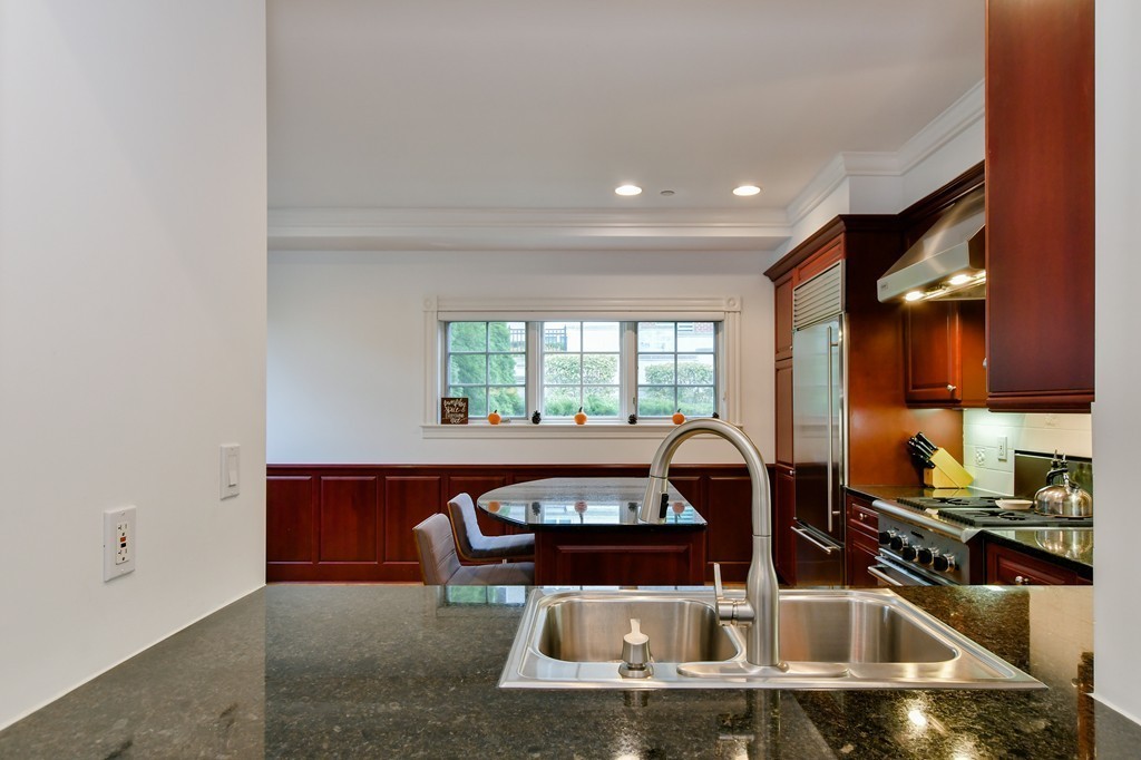 90 Constitution Road, Unit 90 Boston, MA 02129 - Photo 16 of 29 a kitchen with a sink and a stove top oven