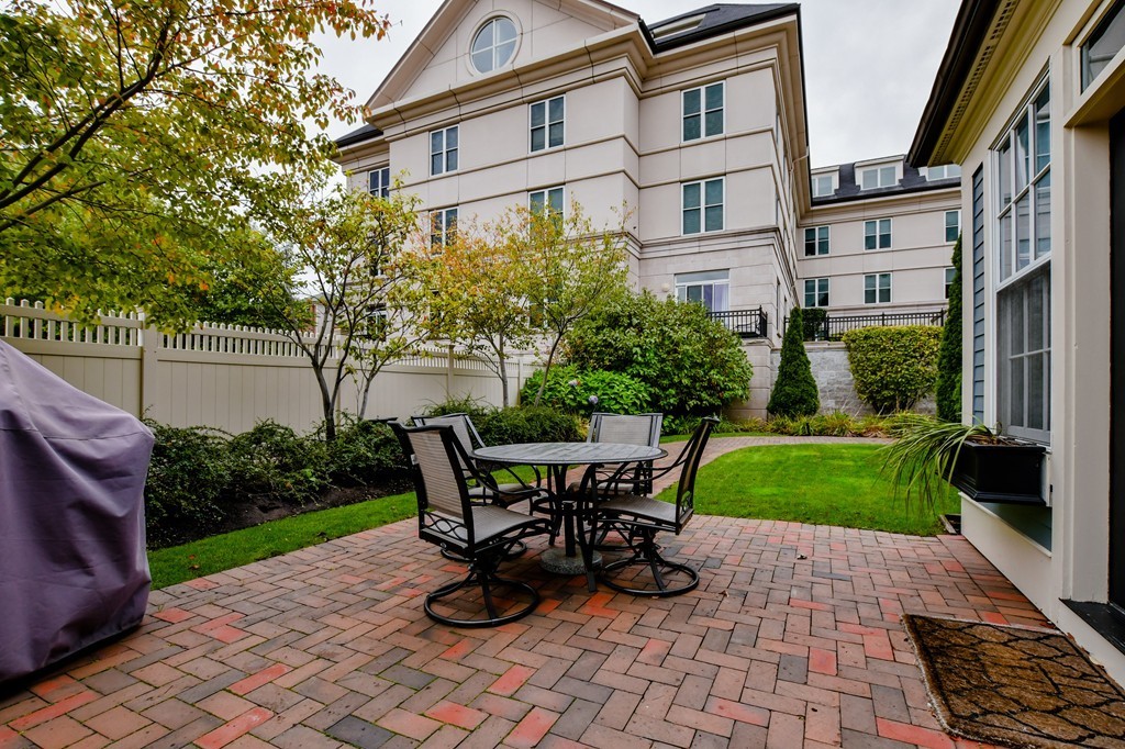 90 Constitution Road, Unit 90 Boston, MA 02129 - Photo 18 of 29 a view of a patio with table and chairs and potted plants