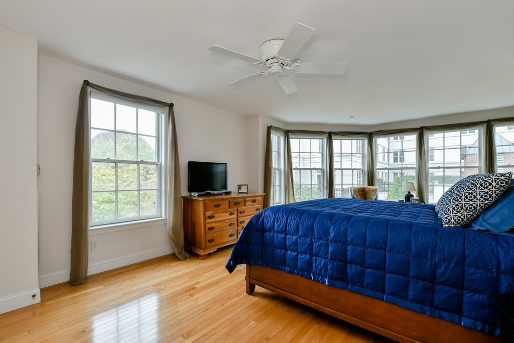 90 Constitution Road, Unit 90 Boston, MA 02129 - Photo 22 of 29 a living room with a bed furniture and a flat screen tv