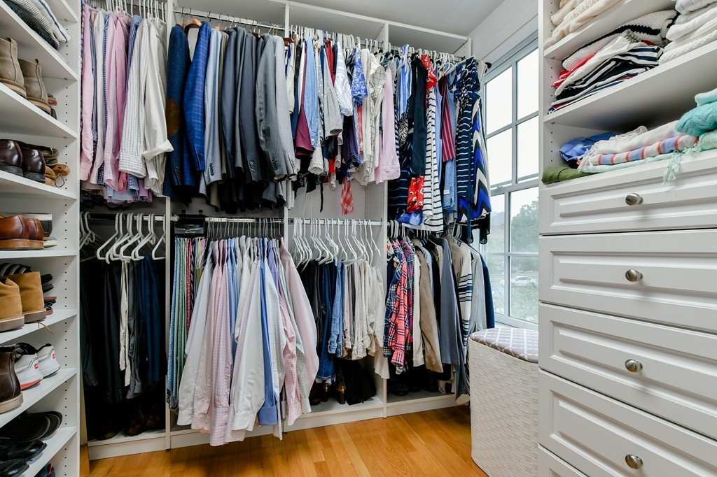 90 Constitution Road, Unit 90 Boston, MA 02129 - Photo 23 of 29 a view of walk in closet with clothes and shoes