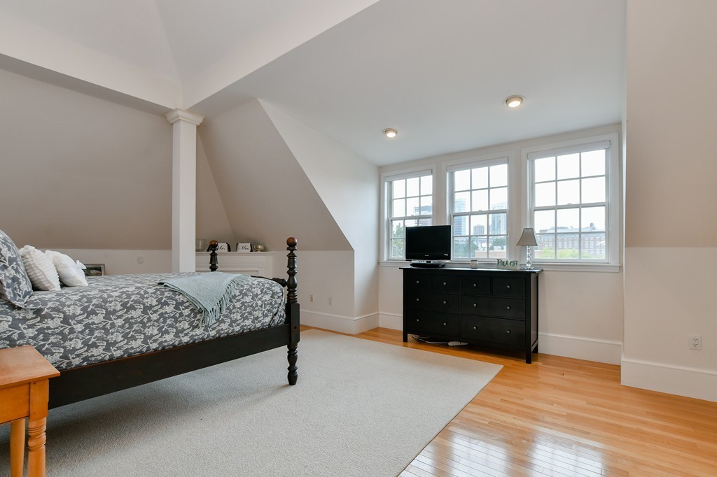 90 Constitution Road, Unit 90 Boston, MA 02129 - Photo 28 of 29 a bedroom with a bed and a dresser