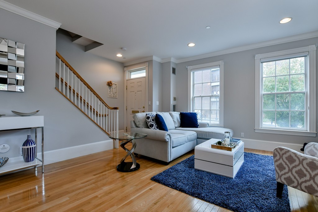 90 Constitution Road, Unit 90 Boston, MA 02129 - Photo 4 of 29 a living room with furniture and wooden floor