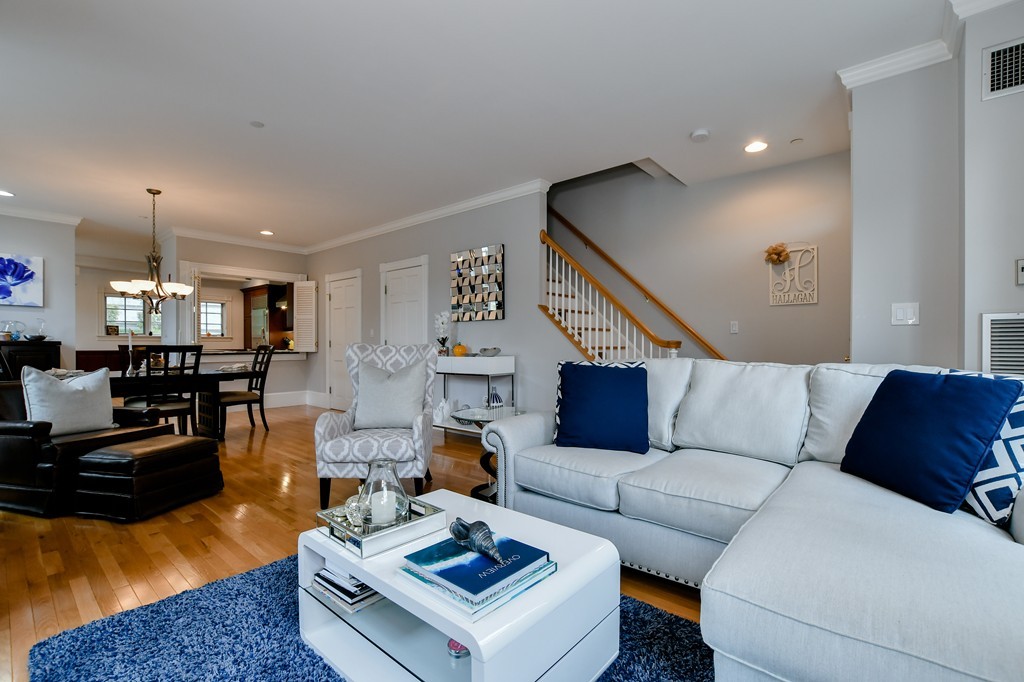 90 Constitution Road, Unit 90 Boston, MA 02129 - Photo 7 of 29 a living room with furniture and wooden floor