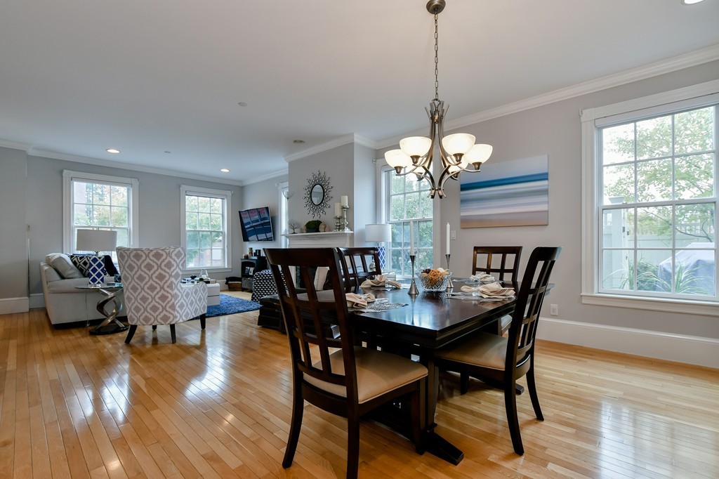 90 Constitution Road, Unit 90 Boston, MA 02129 - Photo 8 of 29 a view of a dining room with furniture window and wooden floor