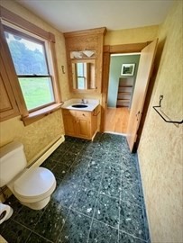 20 Slab Bridge Road Freetown, MA 02702 - Photo 10 of 42 a bathroom with a granite countertop sink and a mirror