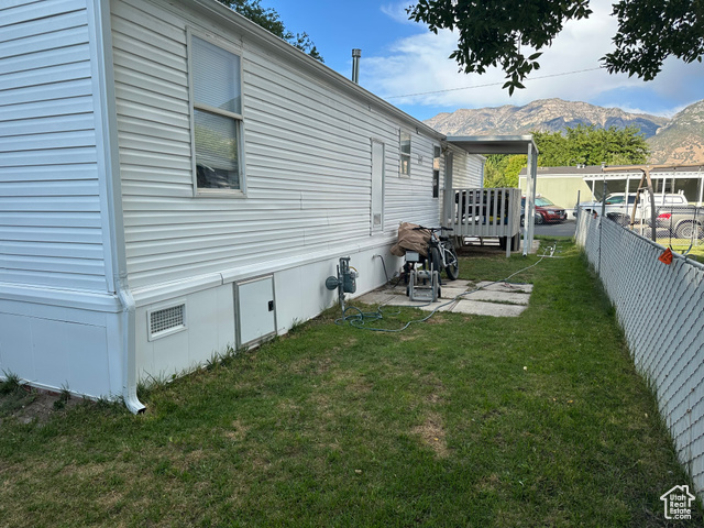 1375 West 500th North, Unit 95 Provo, UT 84601 - Photo 17 of 19 View of side of property featuring a deck with mountain view