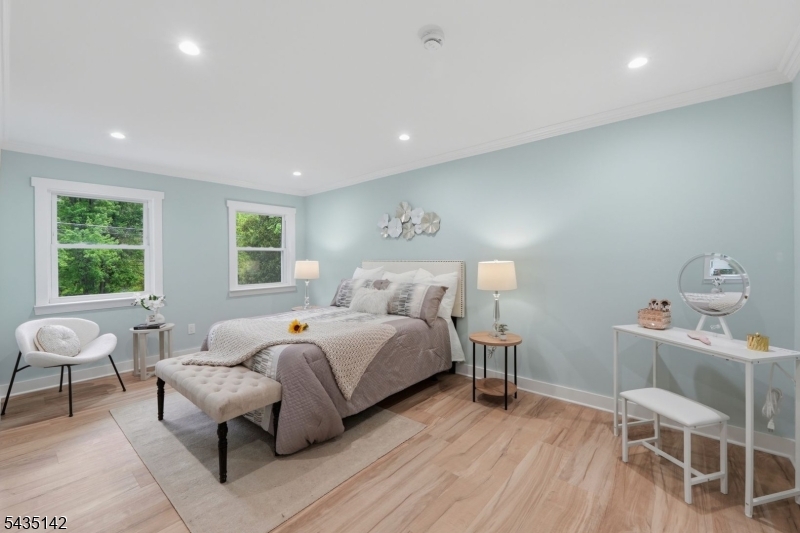 36 Ruth Street Hopatcong, NJ 07874 - Photo 10 of 25 a bedroom with a bed and a wooden floor