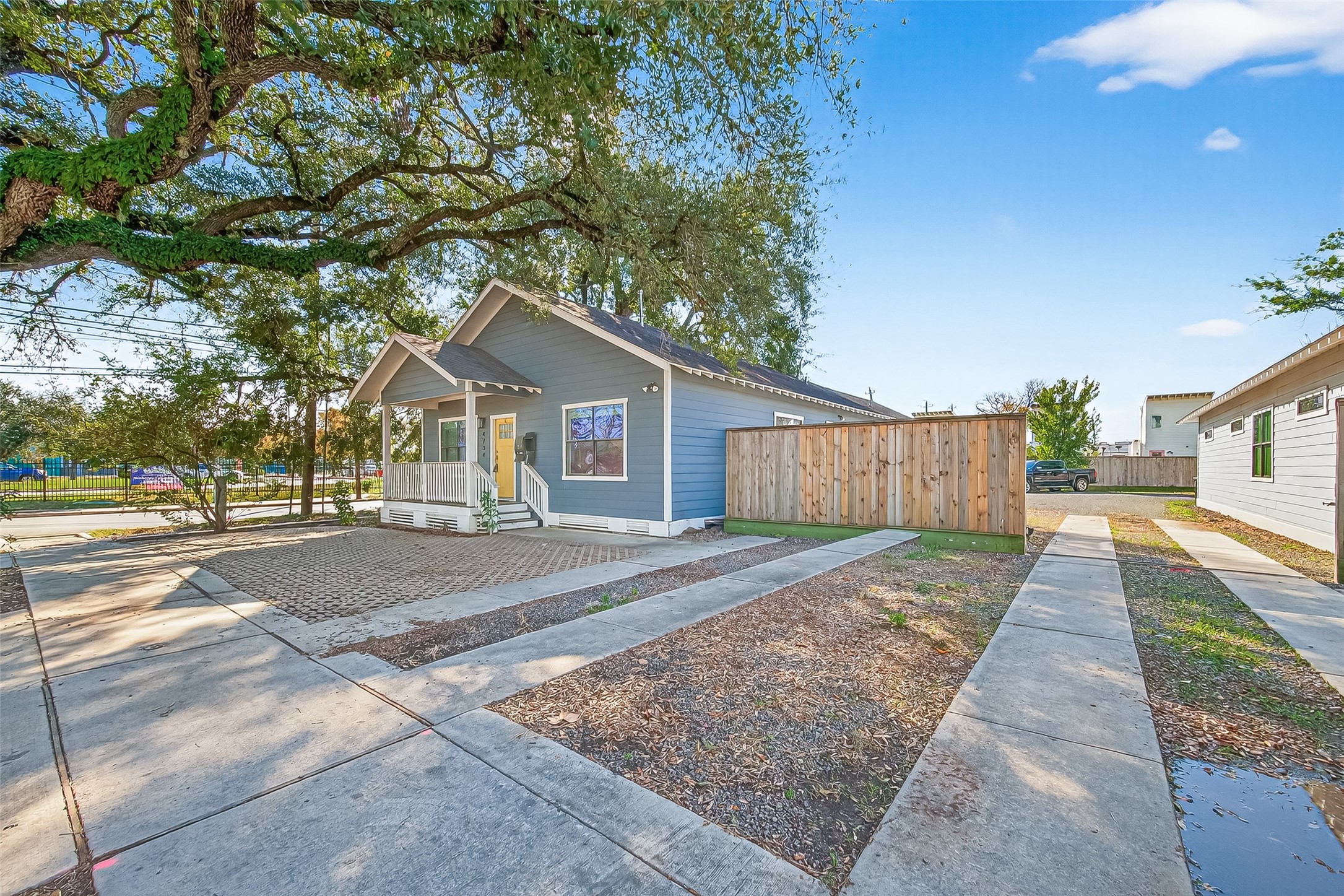 4734 Bell Street Houston, TX 77023 - Photo 36 of 42 a view of a house with a yard and large tree