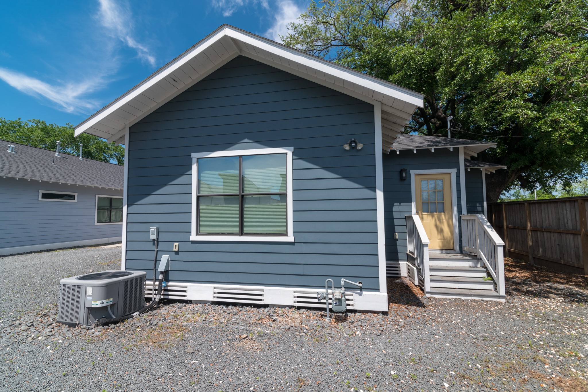 4734 Bell Street Houston, TX 77023 - Photo 5 of 42 a view of house with a large window and wooden fence