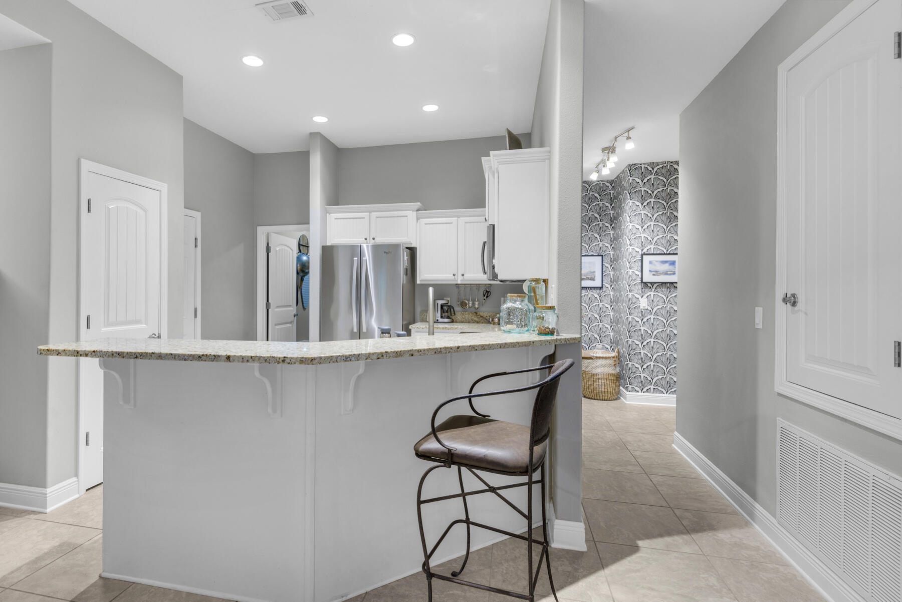 43 Hollyn Court Freeport, FL 32439 - Photo 12 of 35 a kitchen with stainless steel appliances granite countertop a sink and a refrigerator