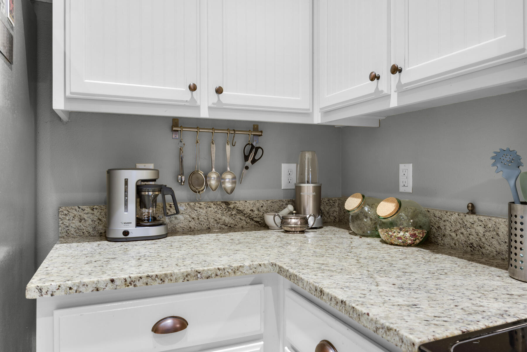 43 Hollyn Court Freeport, FL 32439 - Photo 15 of 35 a kitchen with a granite countertop sink and white cabinets