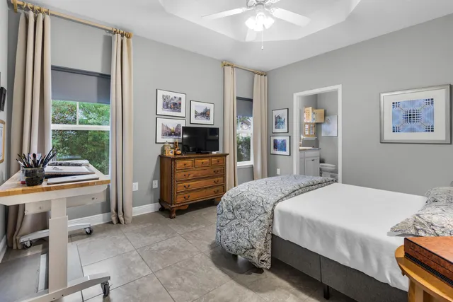 a bathroom with a toilet and a shower curtain