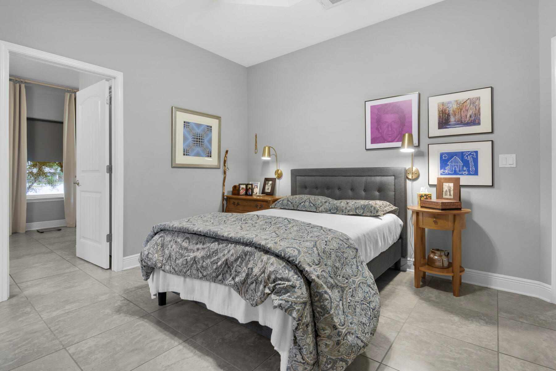 43 Hollyn Court Freeport, FL 32439 - Photo 17 of 35 a bedroom with a bed and painting on the wall