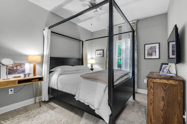 a bathroom with a bathtub and a window