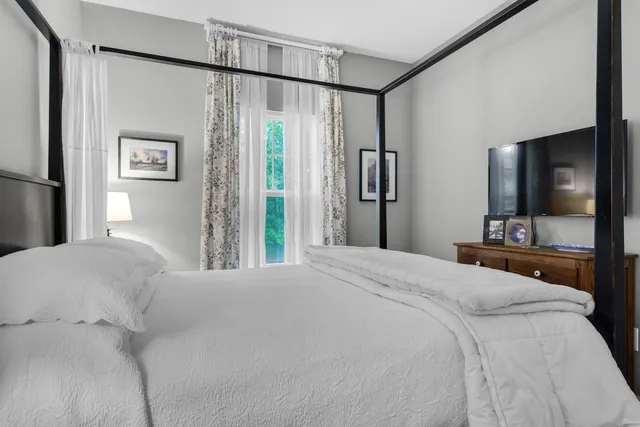 a bathroom with a granite countertop sink mirror toilet and bathtub