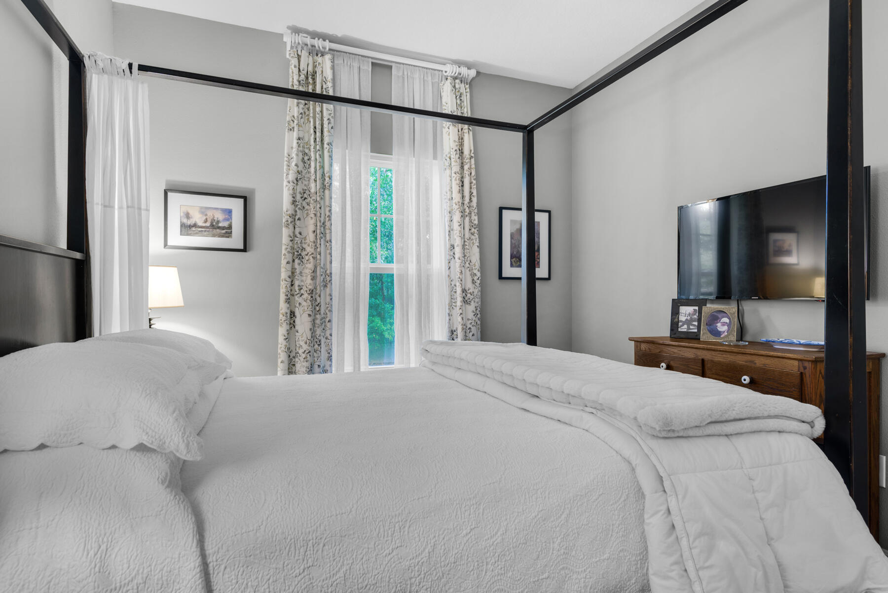 43 Hollyn Court Freeport, FL 32439 - Photo 20 of 35 a bedroom with a bed and a flat screen tv