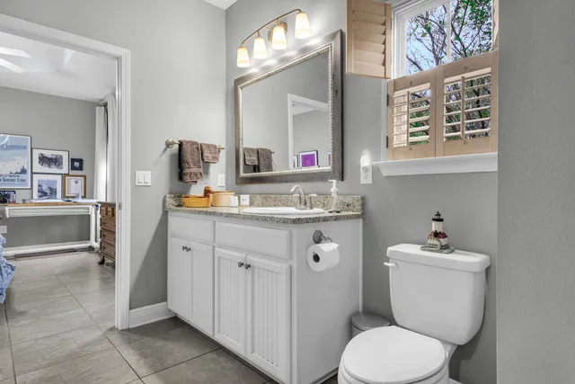 a view of a backyard with a table and chairs