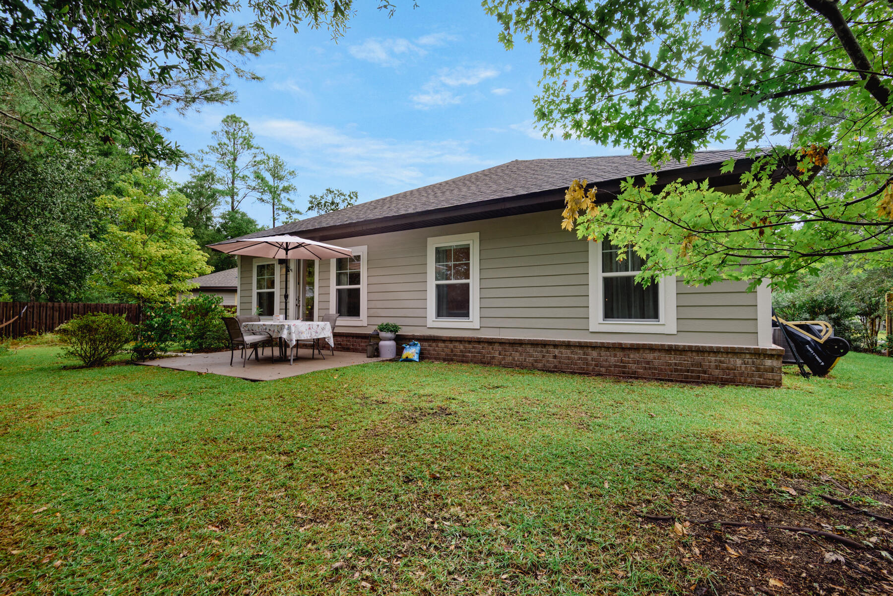 43 Hollyn Court Freeport, FL 32439 - Photo 28 of 35 a view of a house with backyard porch and garden